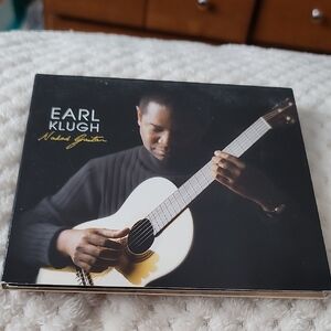 album "Naked Guitar" by Earl Klugh, a studio album.